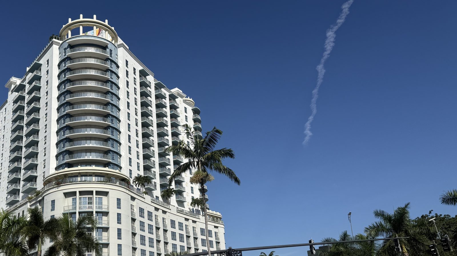 Mid-rise condominium tower with curved balconies overlooking Young Circle in downtown Hollywood, Florida