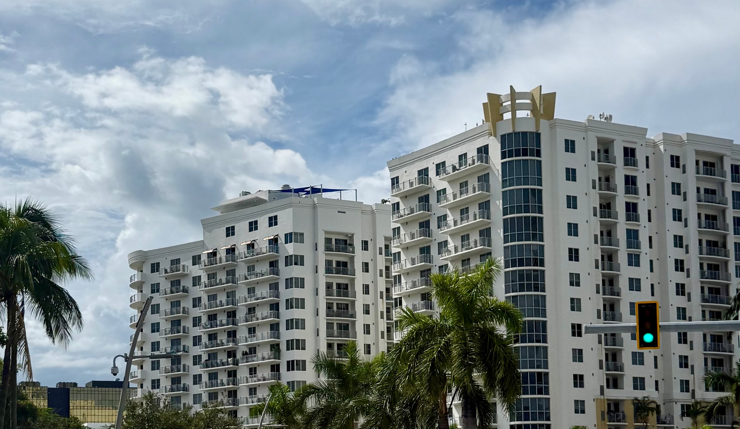 Mid-rise condominium buildings with ground-floor storefronts on Young Circle in downtown Hollywood, Florida